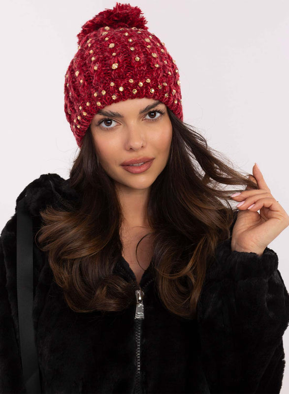 Red padded hat with rhinestones and pompom