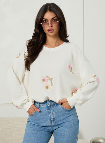 Oversized cream sweater with floral embroidery
