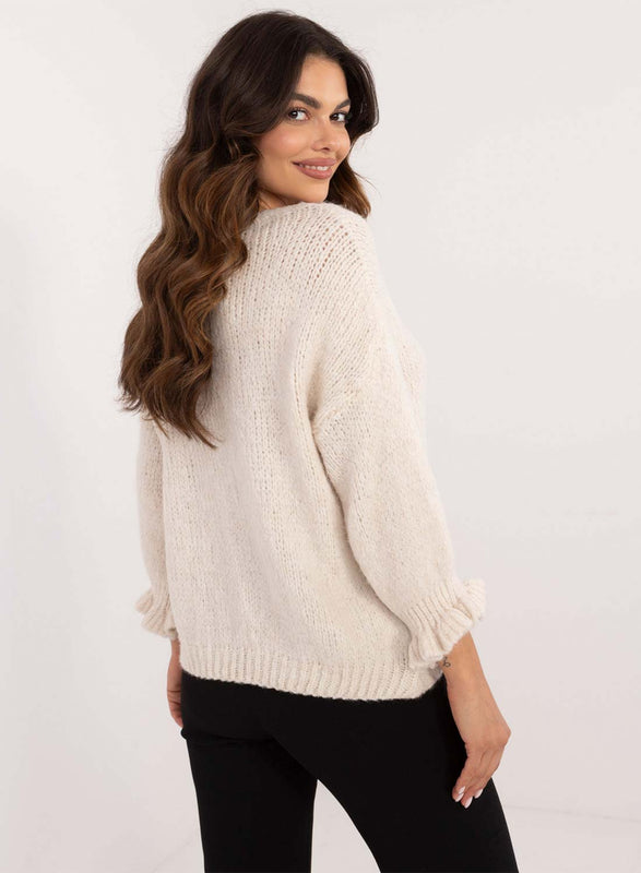 Pull crème avec manches bouffantes