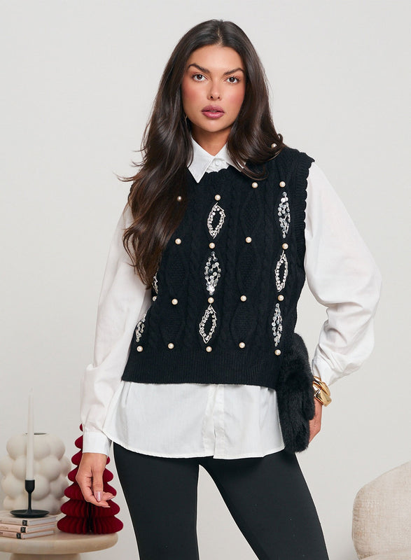 Black bootcut pants decorated with rhinestones