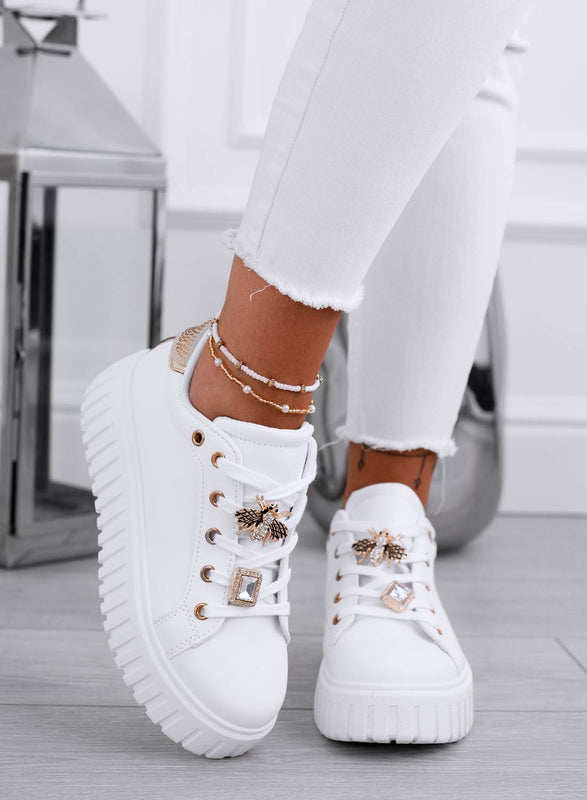 White sneakers with gold bee jewel embellishment