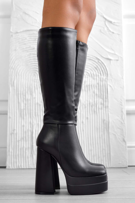 Black faux leather boots with high heel and platform
