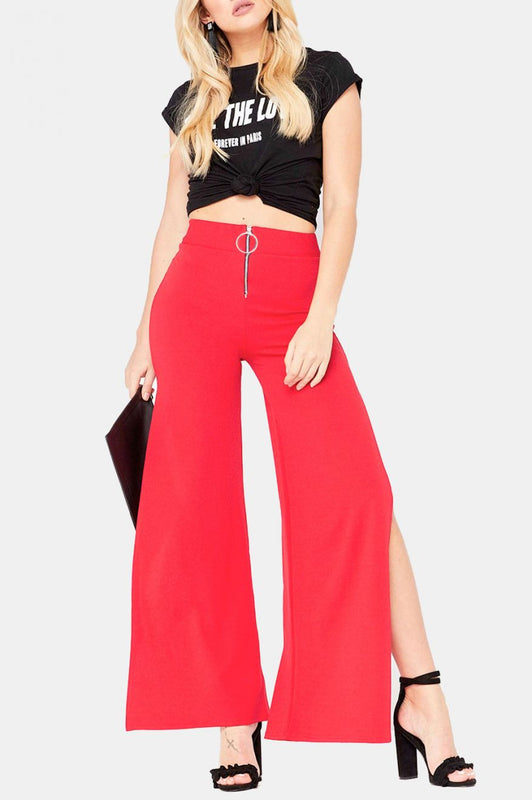 Pantalon rouge avec zip et fentes latérales