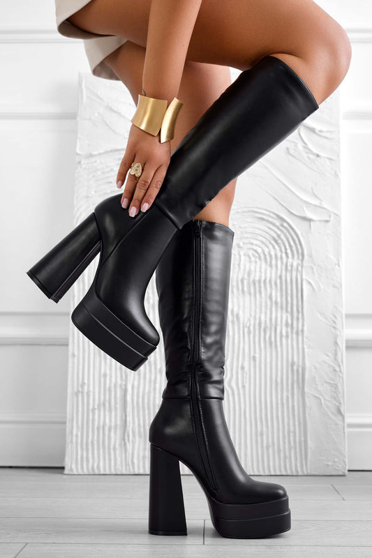 Black faux leather boots with high heel and platform