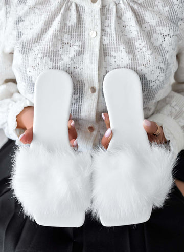 White slip-on sandals with faux fur
