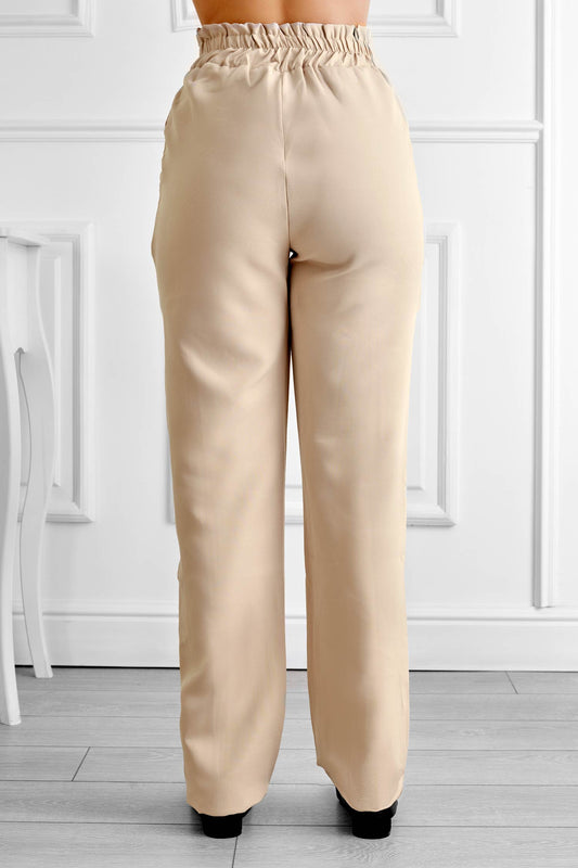 Pantalon beige avec ressort et cordon de serrage à la taille