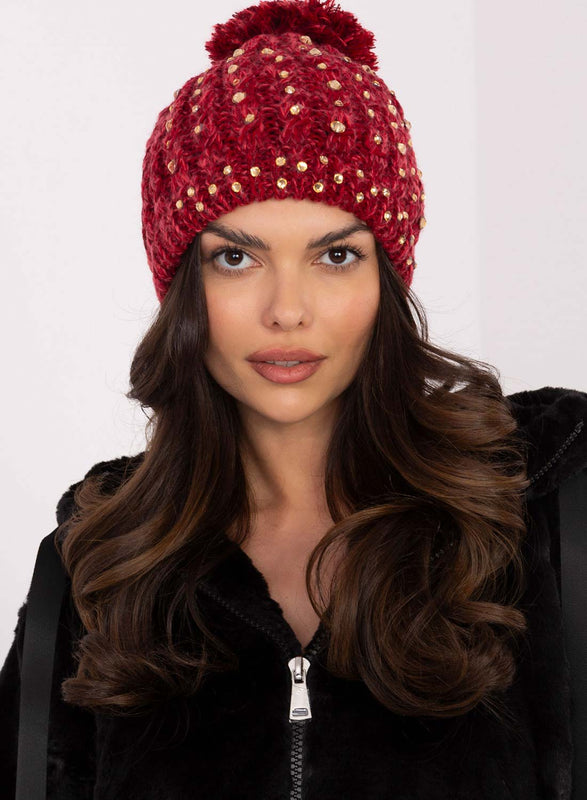 Red padded hat with rhinestones and pompom