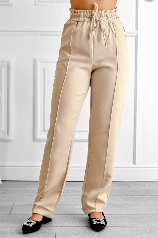 Pantalon beige avec ressort et cordon de serrage à la taille