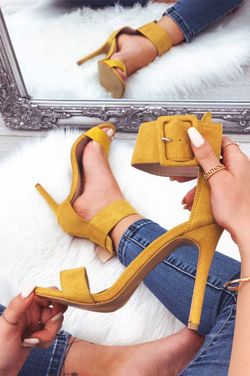 Mustard yellow suede sandals with high heel and ankle strap