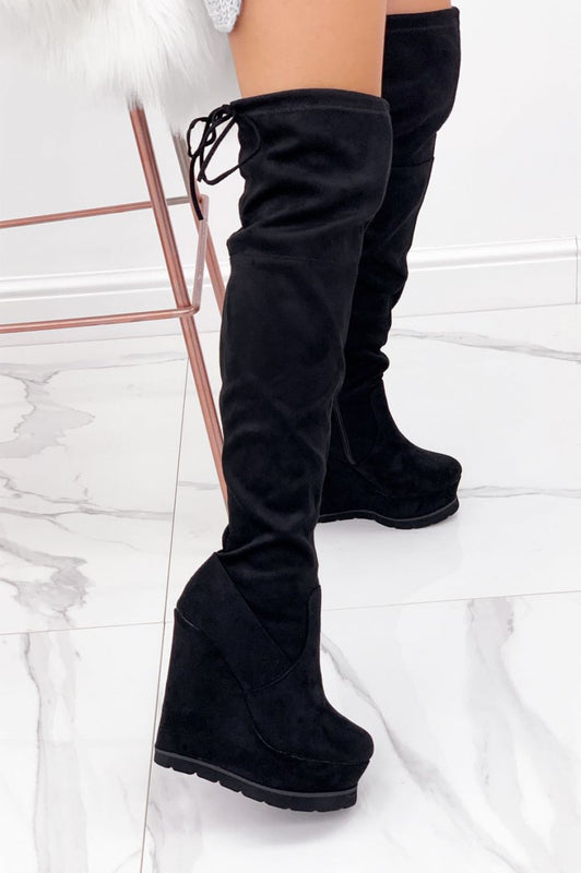 Cuissardes noires en daim avec semelle compensée