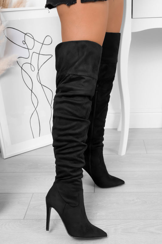 Black suede over-the-knee boots with high heel