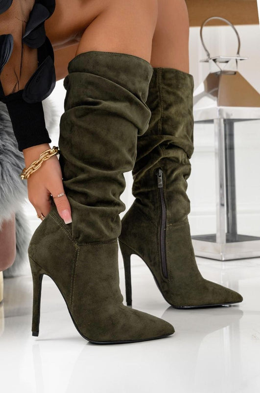 Green ruched ankle boots at calf height