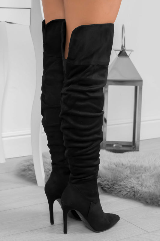 Black suede over-the-knee boots with high heel