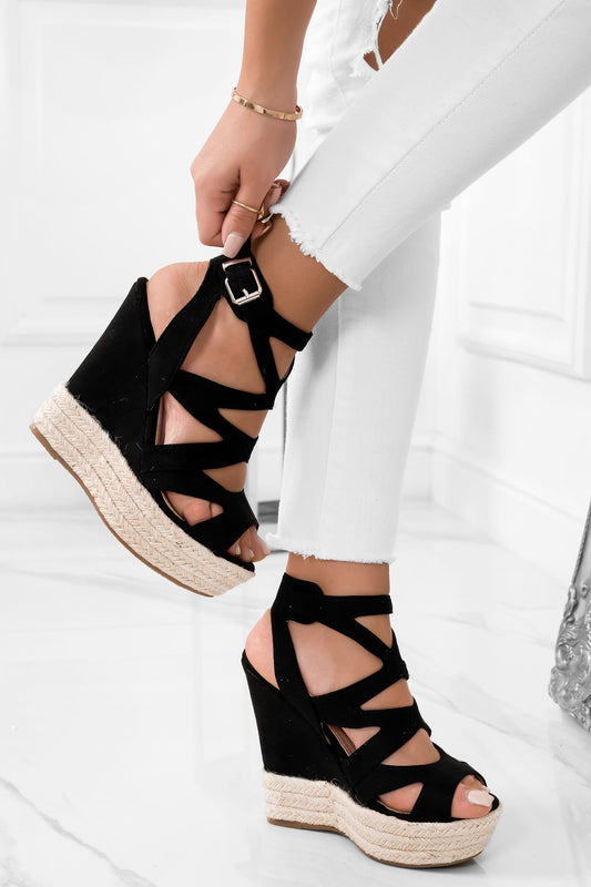 Sandales noirs enveloppants à semelle compensée